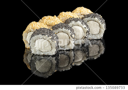 Elegant sushi rolls filled with creamy cheese are coated in contrasting black and white sesame seeds, arranged on a glossy reflective black surface Elegant sushi rolls filled with creamy cheese are coated in contrasting black and white sesame seeds, arranged on a glossy reflective black surface 135089733
