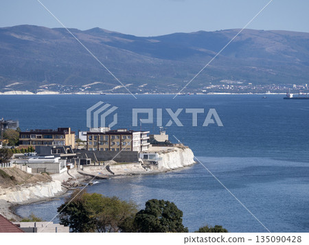 August 12 2025 Top view from Mount Koldun overlooking the sea and coastline toward the resort village of Myskhako near Novorossiysk Russia on the Black Sea coast. Coastal landscape and shoreline 135090428