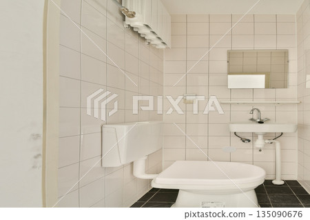 This image showcases a sleek and minimalistic bathroom design featuring modern fixtures, clean lines, and a neutral color palette that enhances the simplicity. This image showcases a sleek and minimalistic bathroom design featuring modern fixtures, clean lines, and a neutral color palette that enhances the simplicity. 135090676