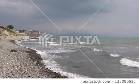 View of Tsemesskaya Bay from Mount Koldun in Myskhako near Novorossiysk, Russia, overlooking the Black Sea coastline, port area and mountainous landscape View of Tsemesskaya Bay from Mount Koldun in Myskhako near Novorossiysk, Russia, overlooking the Black Sea coastline, port area and mountainous landscape 135090685