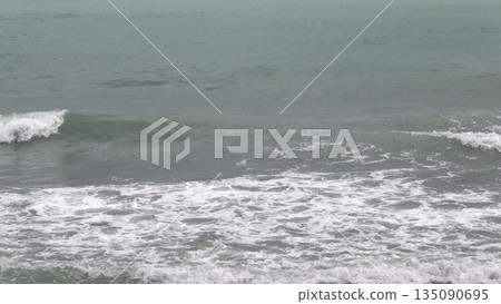 Panoramic view of the sea from a rocky hillside with pine trees under a clear blue summer sky Panoramic view of the sea from a rocky hillside with pine trees under a clear blue summer sky 135090695