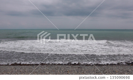 Panoramic view of the sea from a rocky hillside with pine trees under a clear blue summer sky Panoramic view of the sea from a rocky hillside with pine trees under a clear blue summer sky 135090698