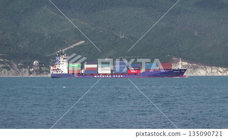 August 24, 2025: Large cargo ship entering the port of Novorossiysk, Russia, on the Black Sea, illustrating maritime transport, industrial shipping and coastal infrastructure 135090721