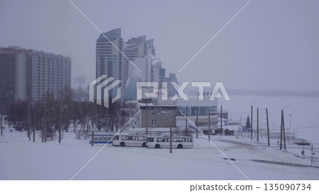 25 January 2023, Barnaul, Russia. River terminal in winter, showing the building, surrounding area, and riverfront in snowy city conditions. 25 January 2023, Barnaul, Russia. River terminal in winter, showing the building, surrounding area, and riverfront in snowy city conditions. 135090734