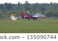 25 July 2021, Russia, Zhukovsky. Russian aerobatic team Swifts flying MiG-29 jets lands with drag chutes deployed at MAKS 2021 air show, demonstrating precision flying and military aviation. 135090744