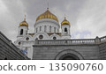 Russia, Moscow. View of the Cathedral of Christ the Savior, showing the exterior architecture, surroundings, and cityscape of the capital. 135090760