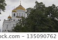 Russia, Moscow. View of the Cathedral of Christ the Savior, showing the exterior architecture, surroundings, and cityscape of the capital. 135090762