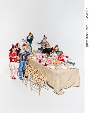 Family birthday dinner with cake desserts and decorations. 135091500