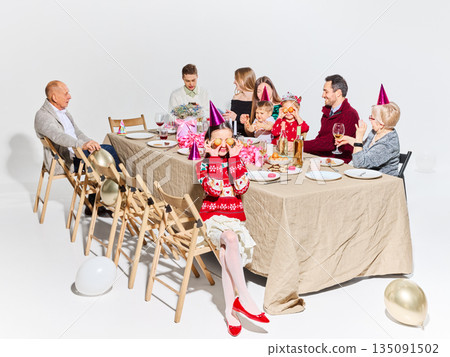 Family birthday celebration with balloons and festive decorations. Family birthday celebration with balloons and festive decorations. 135091502