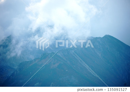 Alps and summer clouds Alps and summer clouds 135091527