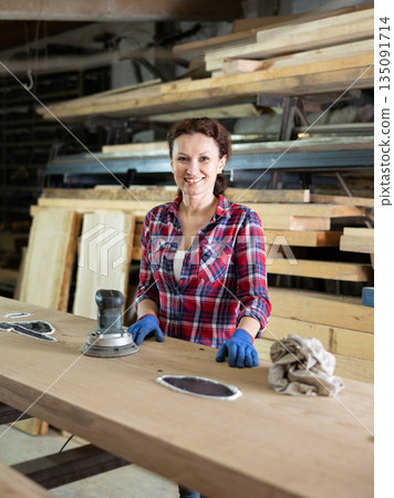 Adult woman posing with oak plank 135091714