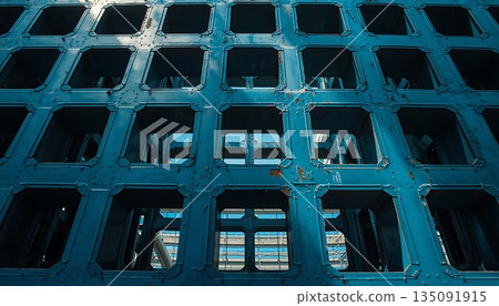 Blue Industrial Architectural Lattice Grid With Repeating Square Openings 135091915