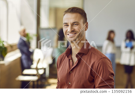 Banner with a group portrait of happy multiethnic people at a work meeting in the office Banner with a group portrait of happy multiethnic people at a work meeting in the office 135092156