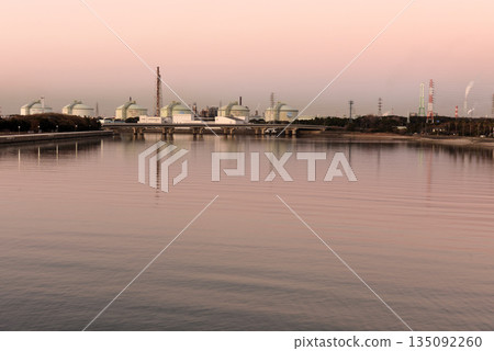 A row of LNG tanks dyed crimson red A row of LNG tanks dyed crimson red 135092260