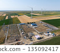 Aerial view of wind turbines with electric power station. 135092417