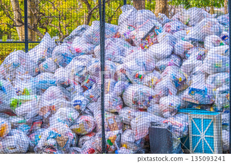 Yokohama, Japan - New Year's cityscape... A garbage dump on a street corner. The first plastic garbage collection day of the year. A mountain taller than a person... = 7th, Yokohama 135093241