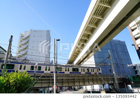 The blue body of the Joban Line train running through Nishi-Nippori 135093442