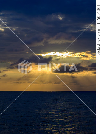 Dark sea and sunset sky Dark sea and sunset sky 135094301