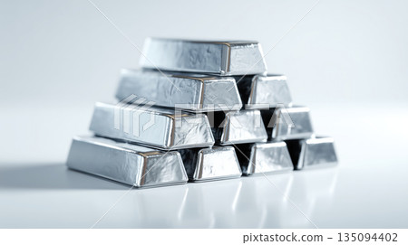 Silver bullion bars stacked in pyramid shape 135094402