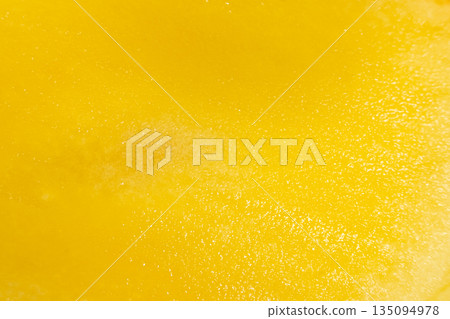 Abstract background of juicy yellow mango fruit flesh. Abstract background of juicy yellow mango fruit flesh. 135094978