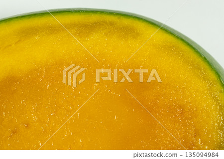 Macro Texture of Slice of Overripe Fresh Mango. Macro Texture of Slice of Overripe Fresh Mango. 135094984