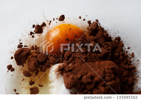 Baked goods ingredients (egg yolks and cocoa powder) 135095502