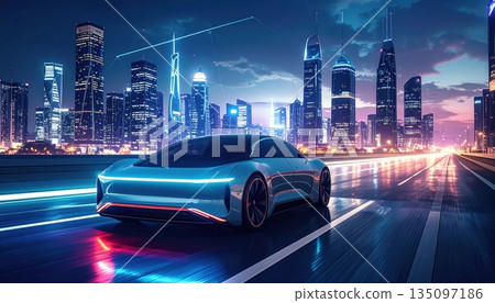 Urban traffic flows through the downtown city street at night as cars drive past illuminated skyscrapers and office buildings in a high speed motion across the highway 135097186