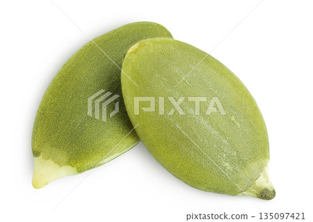 Peeled pumpkin seeds isolated on white background. Top view. Flat lay Peeled pumpkin seeds isolated on white background. Top view. Flat lay 135097421