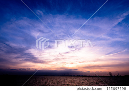 Sunset over rice field Sunset over rice field 135097596