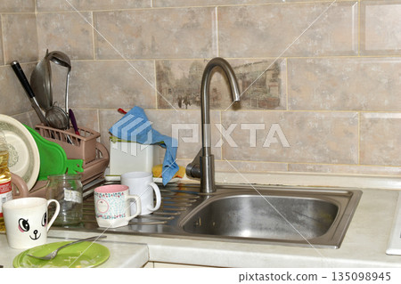 Kitchen. Dishes near the sink. 135098945