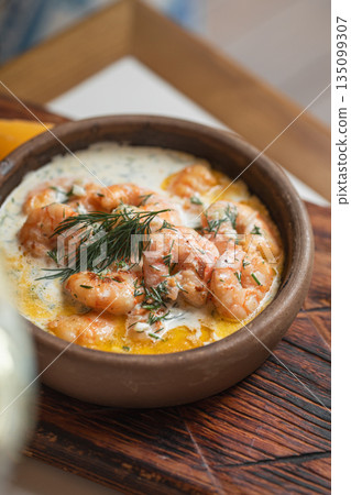Georgian shrimp dish in creamy garlic sauce 135099307