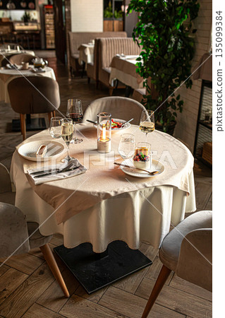 Restaurant table setup with candlelight and wine 135099384