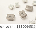 Old chips on a white background. Different electronic chips. Microcircuits in a metal case. 135099688
