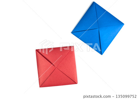 Blue and red game squares for Ttakji. Game of throwing piece into ground to flip enemy piece. Idea for creating game using paper. Ttakji on white background, concept for simple game variation 135099752