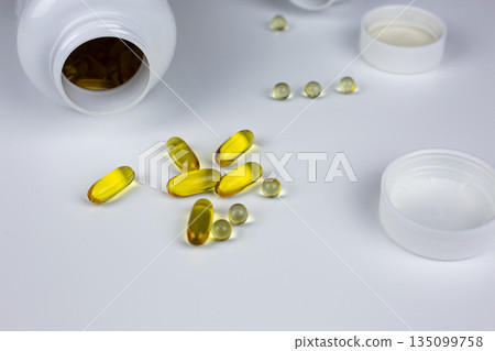 Omega 3 supplement capsules for food supplementation, round gelatin capsules of vitamin D3 with K2. Vitamins for maintaining brain and heart health. Essential vitamins for the body 135099758