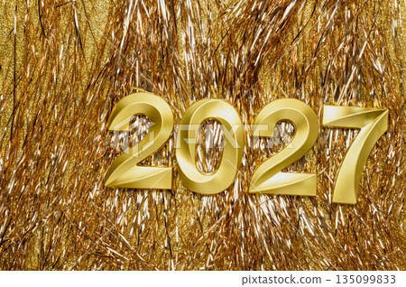 Holiday background Happy New Year 2027. Numbers of year 2027 made by gold candles on bokeh festive Gold Tinsel background. celebrating New Year holiday, close-up. Space for text Holiday background Happy New Year 2027. Numbers of year 2027 made by gold candles on bokeh festive Gold Tinsel background. celebrating New Year holiday, close-up. Space for text 135099833