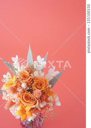 Orange bouquet in a vase (orange background) Orange bouquet in a vase (orange background) 135100330