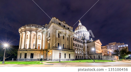 Mississippi State Capitol building stands in Jackson, USA. Historic Beaux-Arts architecture features the illuminated dome and stone columns under a dark night sky 135100456