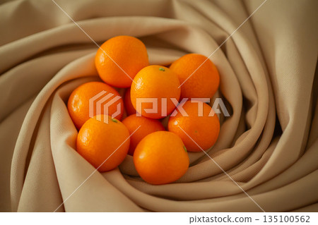 ripe kumquat by chance 135100562