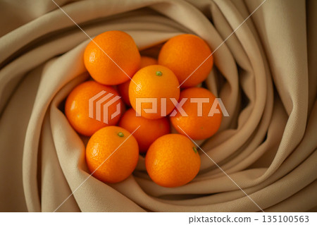 ripe kumquat by chance 135100563