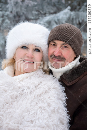 Elderly Couple Enjoying Snowy Walk, Loving Seniors Immersed In Snowy Forest During Holiday Season, Happy Elderly Couple Embracing In Snowy Woods With Festive Atmosphere And Heartfelt Laughter Elderly Couple Enjoying Snowy Walk, Loving Seniors Immersed In Snowy Forest During Holiday Season, Happy Elderly Couple Embracing In Snowy Woods With Festive Atmosphere And Heartfelt Laughter 135100839