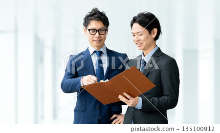 Two male businessmen having a meeting 135100912