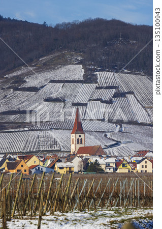 Ammerschwihr village church and snow covered vineyards in Alsace, France Ammerschwihr village church and snow covered vineyards in Alsace, France 135100943