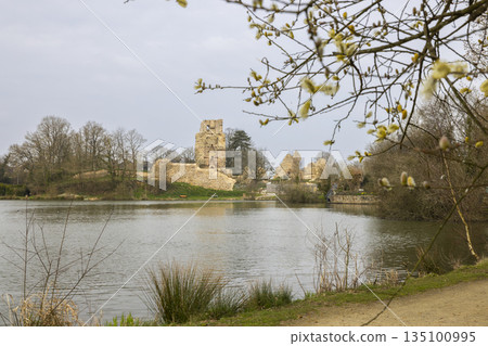 Saint Aubin du Cormier castle ruins reflecting on lake water 135100995