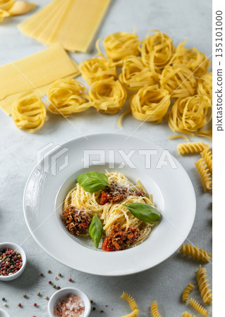 Italian pasta with bolognese sauce, fresh basil and parmesan Italian pasta with bolognese sauce, fresh basil and parmesan 135101000
