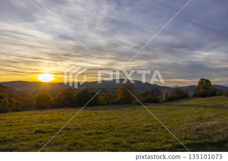 Golden sunset over autumn hills in Budina, Slovakia Golden sunset over autumn hills in Budina, Slovakia 135101073