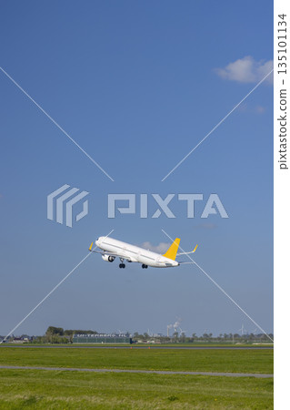 White airplane taking off from runway in Vijfhuizen 135101134