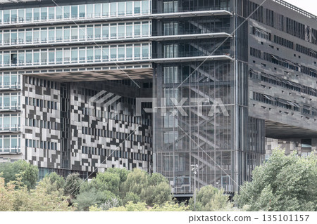 Modern building facade featuring geometric patterns in Montpellier, France Modern building facade featuring geometric patterns in Montpellier, France 135101157