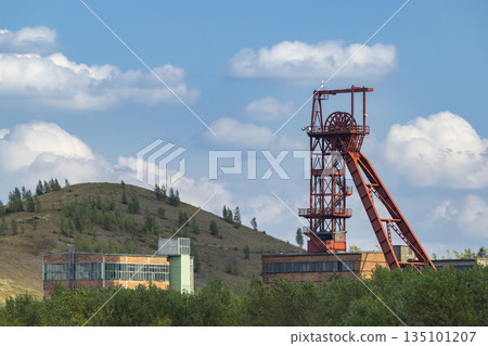 Zacler coal mine headframe under blue sky 135101207
