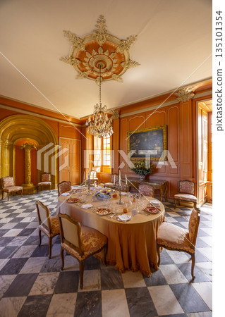 Ornate dining room set for formal dinner in Chateau de Villandry Ornate dining room set for formal dinner in Chateau de Villandry 135101354